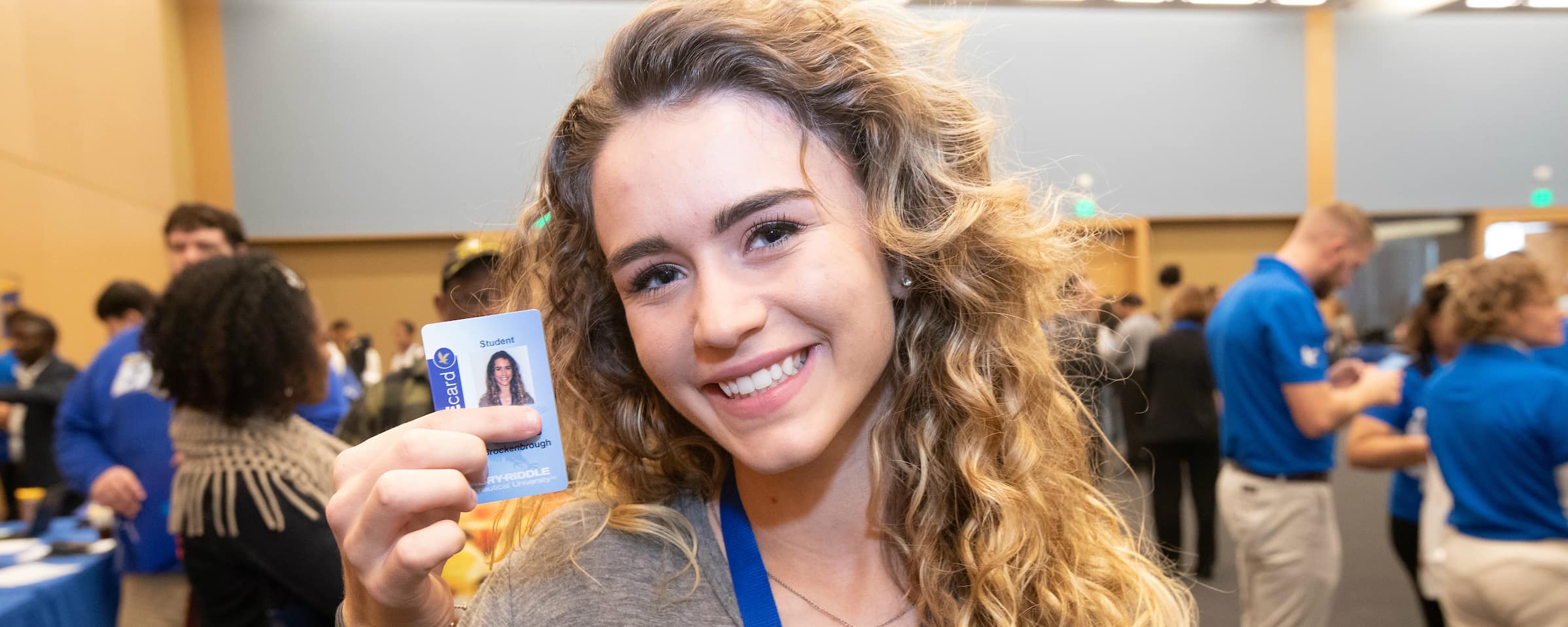 a female student gets her new eagle card