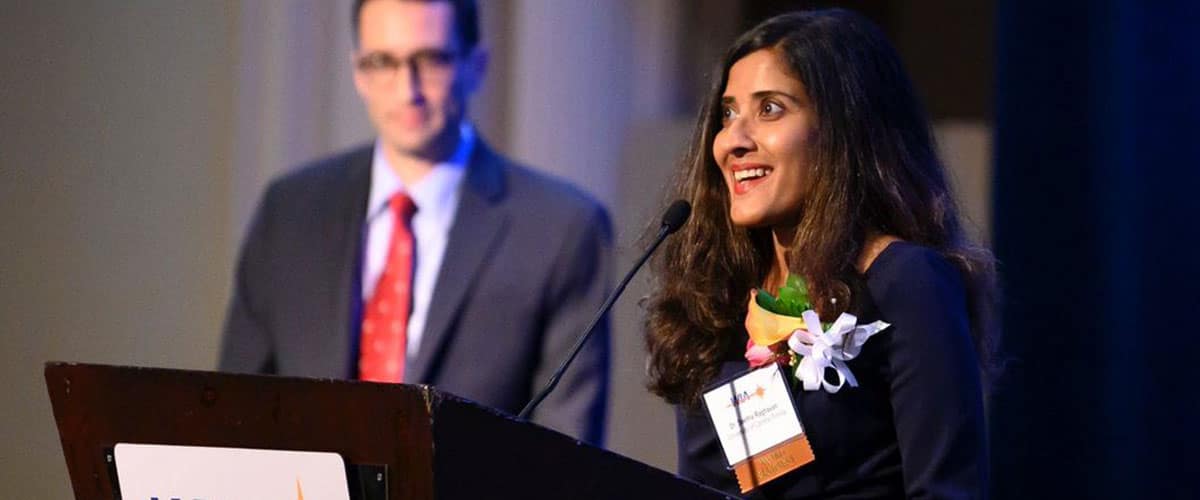 Dr. Raghavan receives the Educator of the Year award from Women in Aerospace
