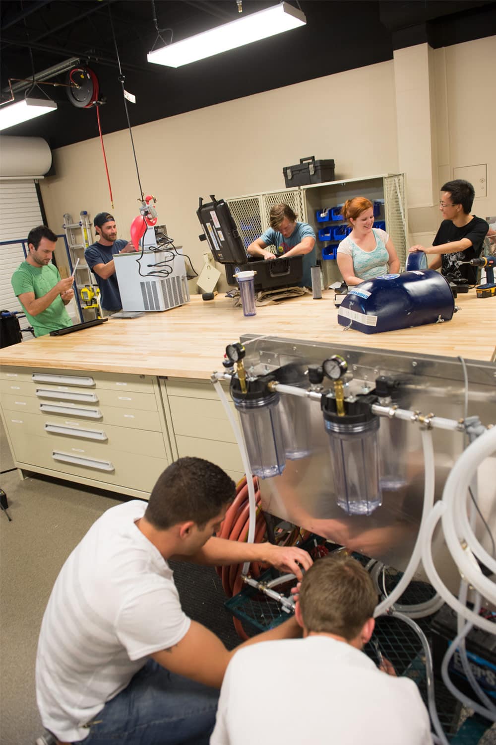 Students work on a water system in the Clean Energy Systems Laboratory