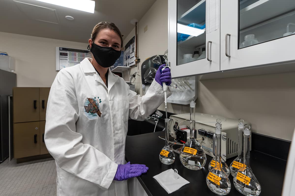 Civil Engineering undergraduate student Devonne Friday prepares a solution to calibrate a Total Organic Carbon Analyzer as part of the aqueous aerosol characterization project.
