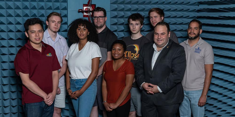 Dr, Rojas poses with other members of the WiDE Lab
