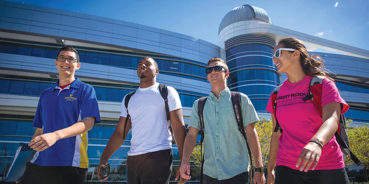students walk across campus