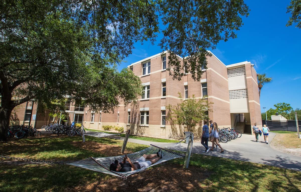 students outside a residence hall