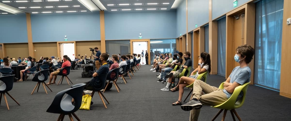 Students sit socially-distanced during Orientation.