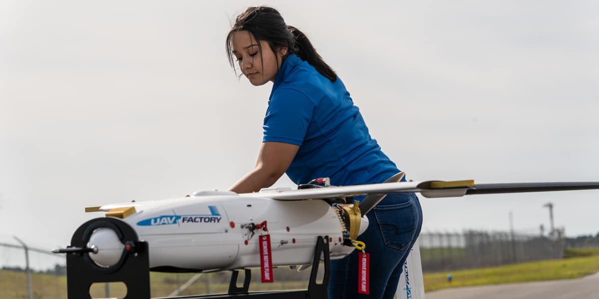 Embry-Riddle UAS student Samantha Villagran assembles the UAV Factory Penguin professional UAV.