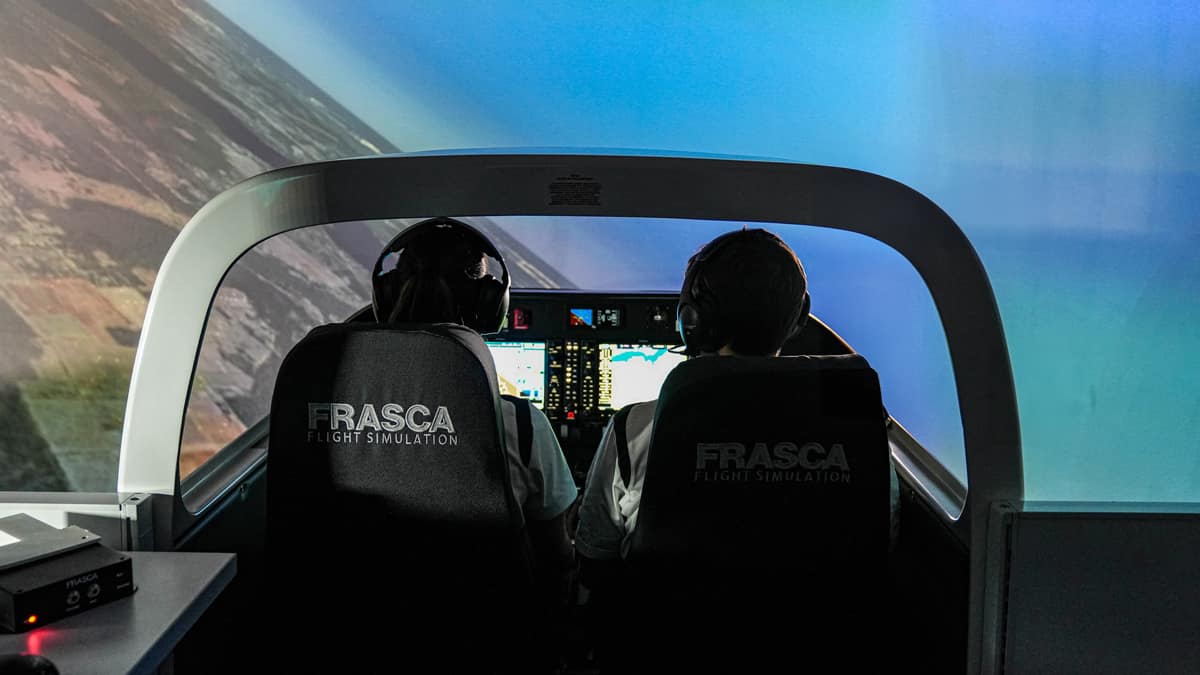 Students flying a Frasca Level 5 Flight Training Device