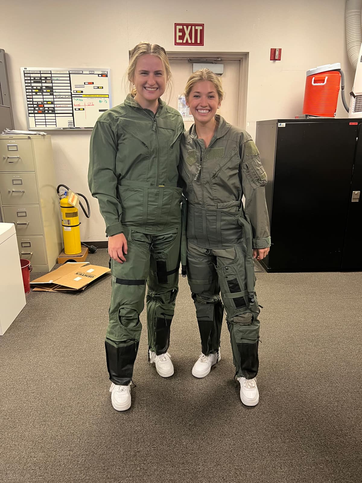 Graduate Students Jamie Talley and McKenna Tooker learning how to use the U2 pilot suit during their summer internship 2022 at Beale AFB as Aerospace Physiologists. 