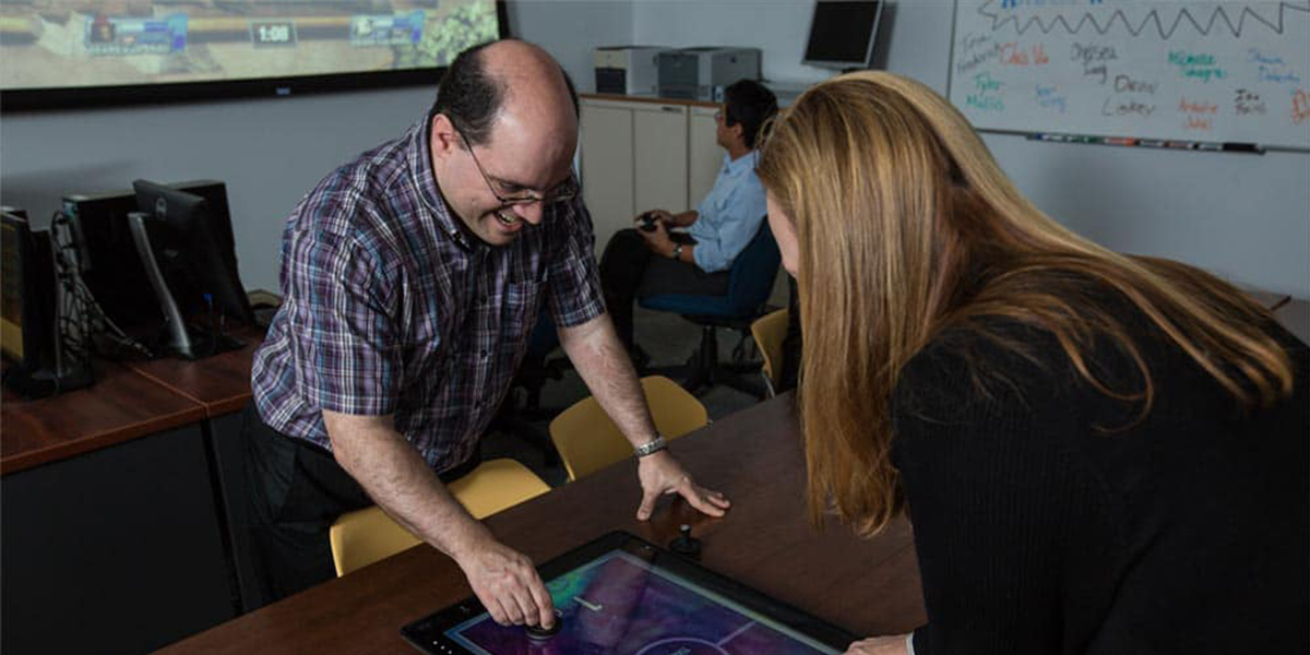Human factors faculty and students play video games in the GEARS Lab. 