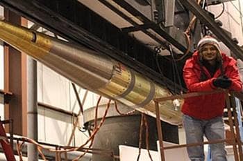 Dr. Barjatya in front of the NASA MTeX rocket that was loaded on the rail at Poker Flat Rocket Range in Alaska