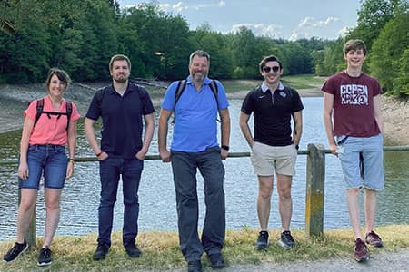 Mike poses with members of the Kinetics group while on a hike to Biergartens