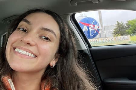 Perla poses outside of NASA