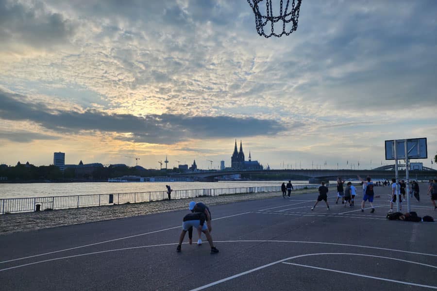 People playing basketball next to the Rhine in Germany