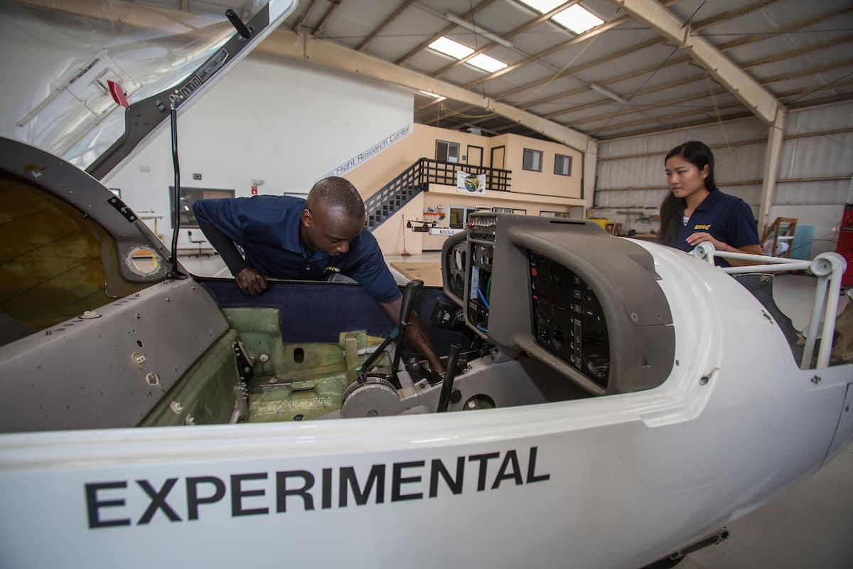 Students working on experimental aircraft