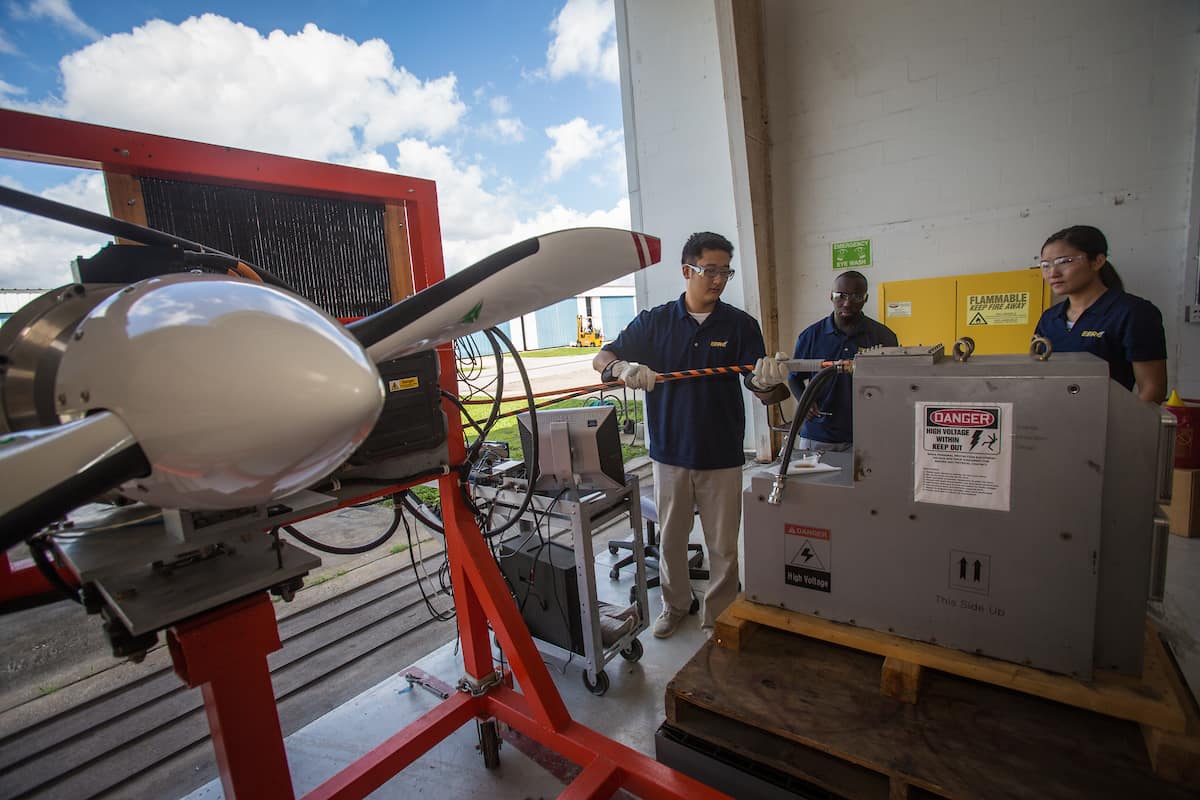 Students working in a hangar