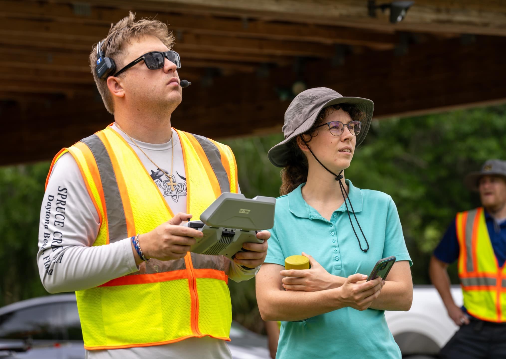 Students watch the sky during a UAV mission to survey Lake Beresford in Deland, using photogrammetry to map water lettuce