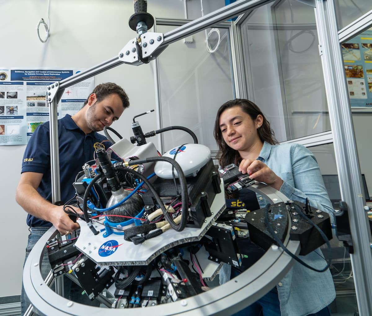 A man and woman in the Advanced Dynamics and Control Laboratory.
