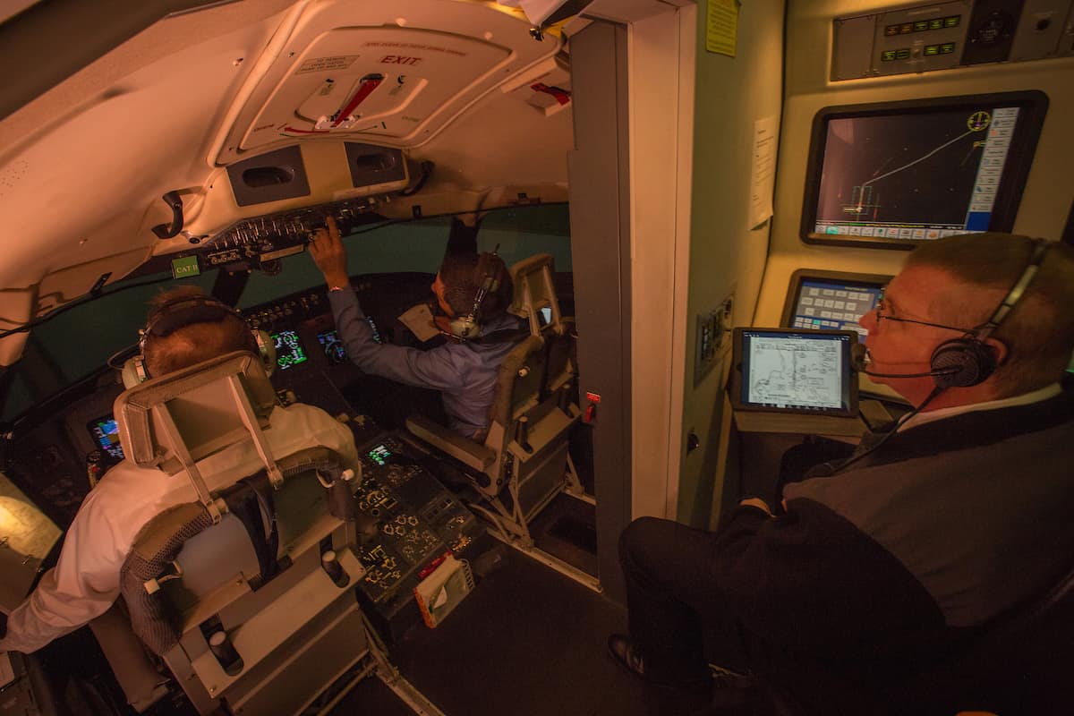 Flight simulator occupied by students