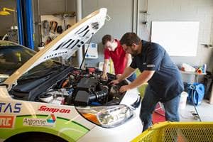 Students work on the EcoCar in the Advanced Vehicles Green Garage