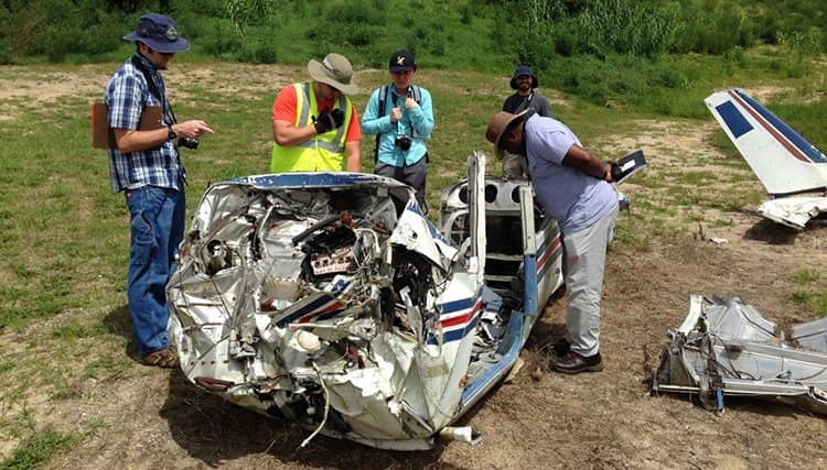Students studying a recreated airplane crash