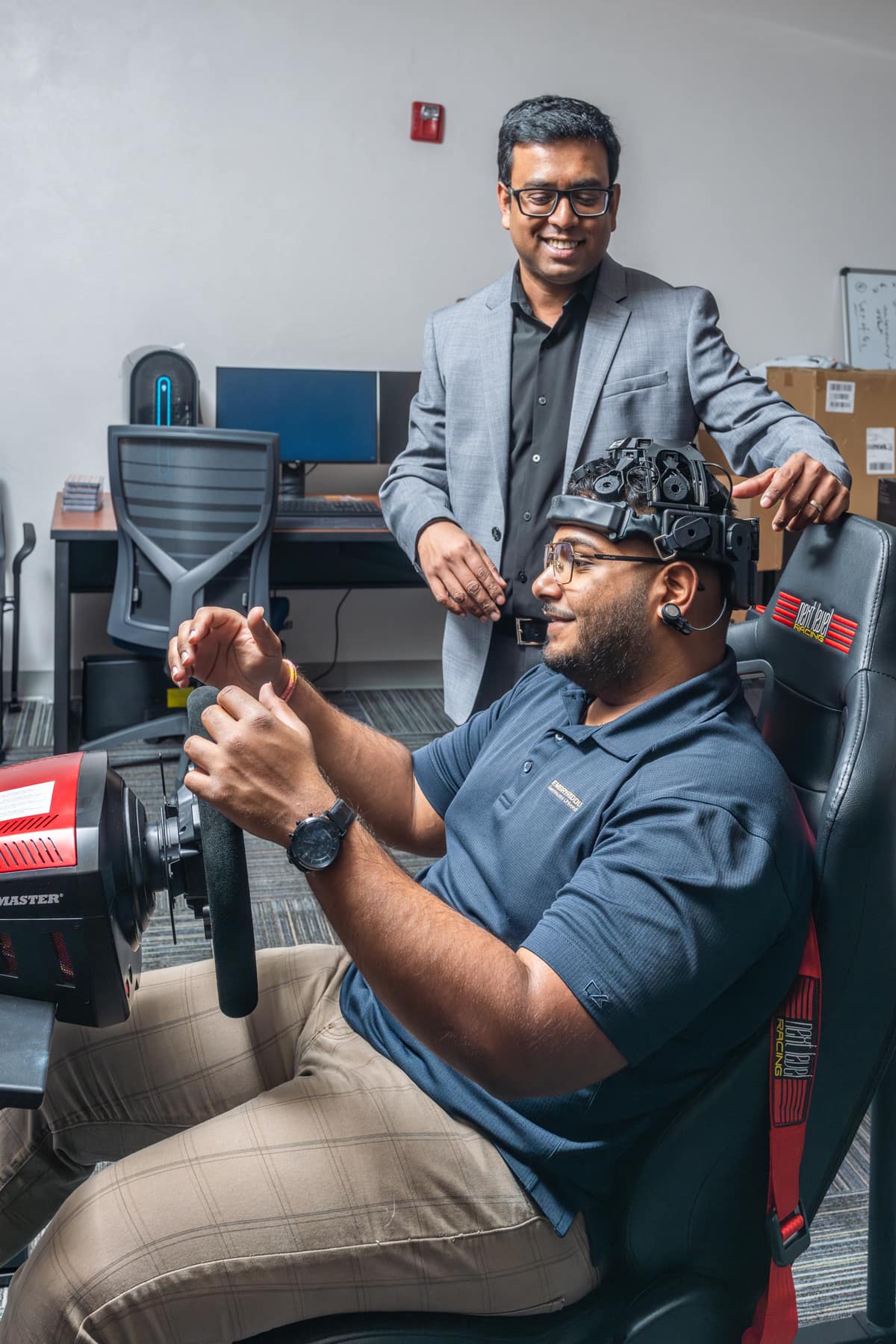 Student on a driving VR machine