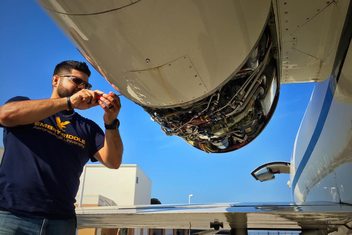 Students perform maintenance on the Lear 35 Jet at the Emil Buehler Aviation Maintenance Sciences Building. Photo taken prior to pandemic and social distancing/masking requirements. (Embry-Riddle/David Massey)