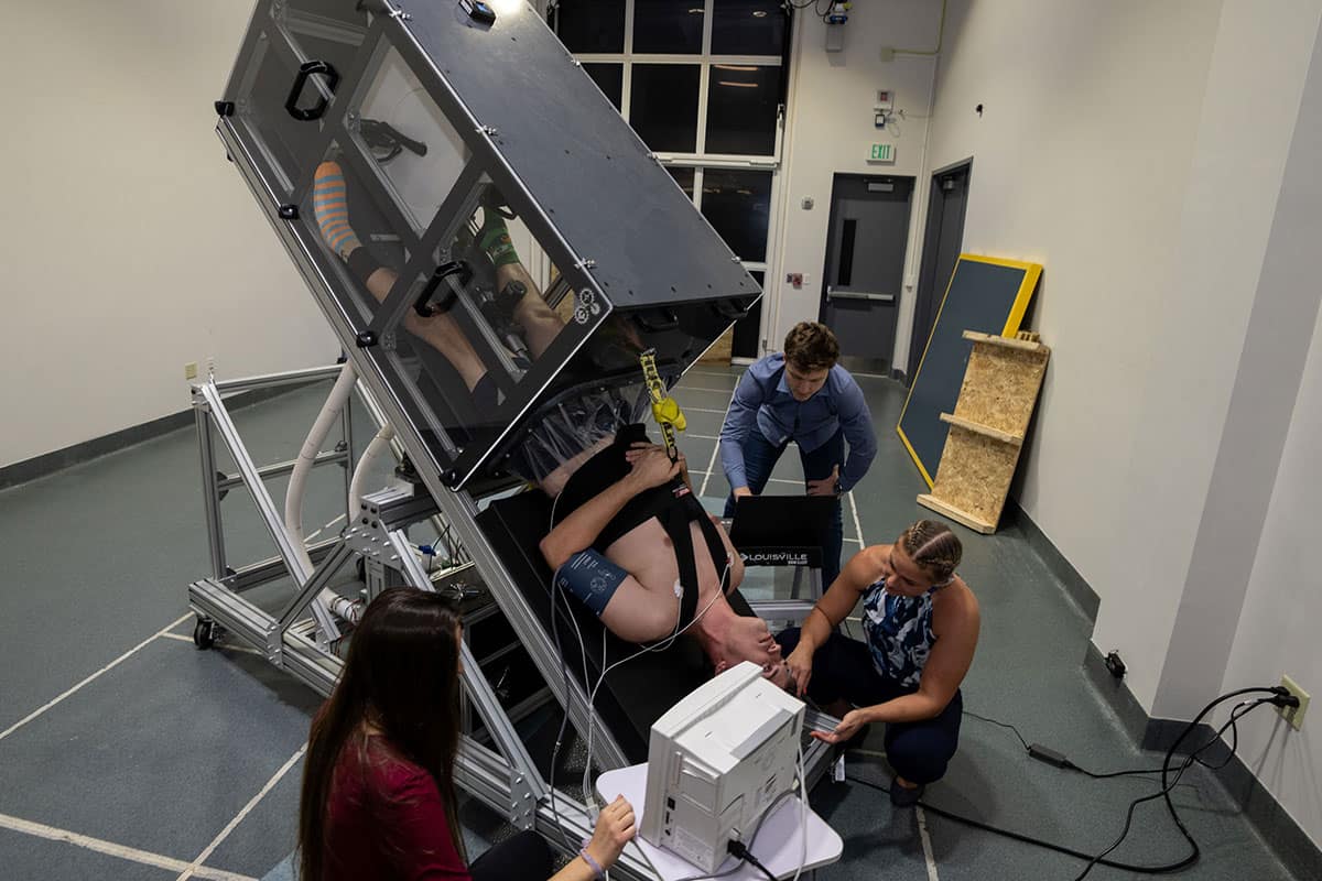 Students performing space physiology research in the ERBAL Lab