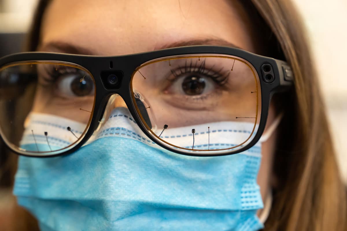 Student wears glasses that track eye movements.