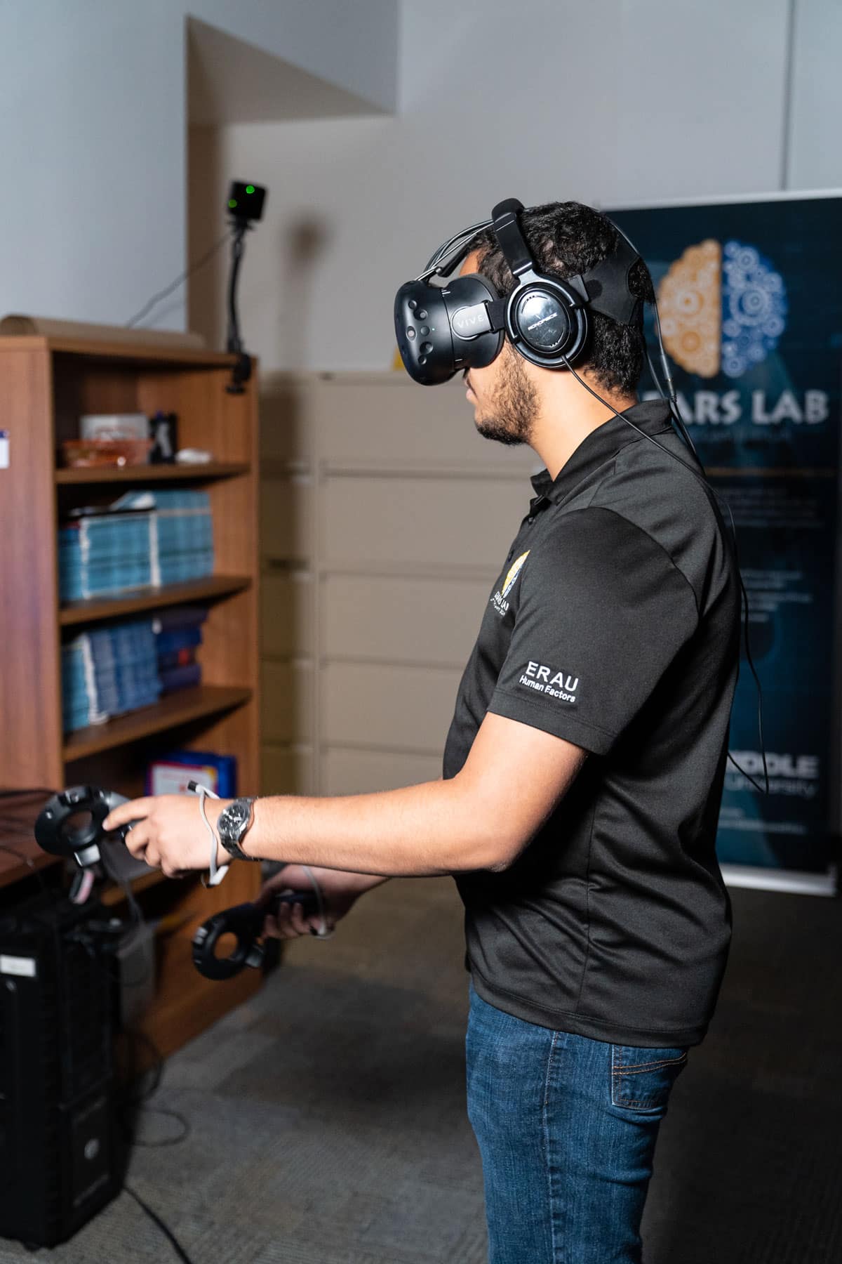Student wears VR Goggles in the lab.