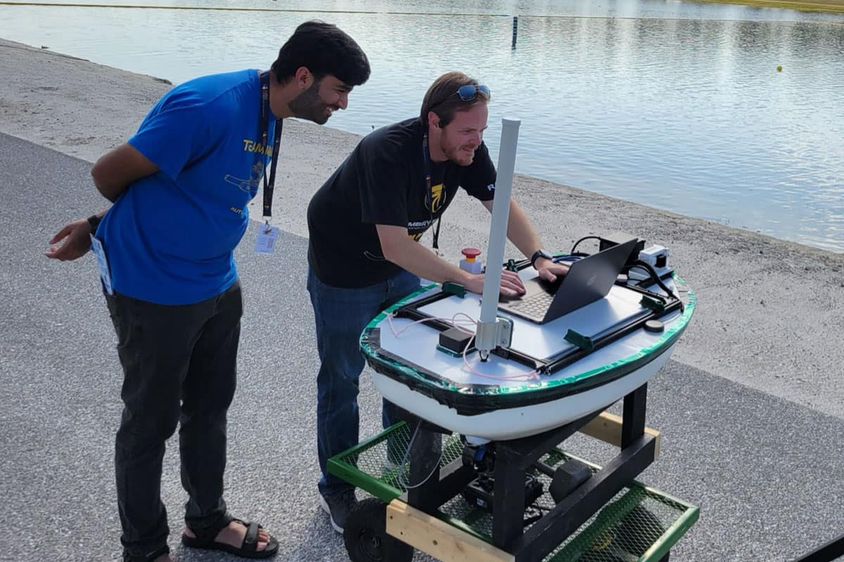 Two members of the Instrumentation, Controls and Robotics Lab working in the field