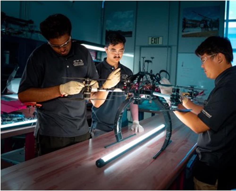 Students work on a drone