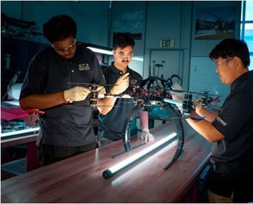 Students work on a drone