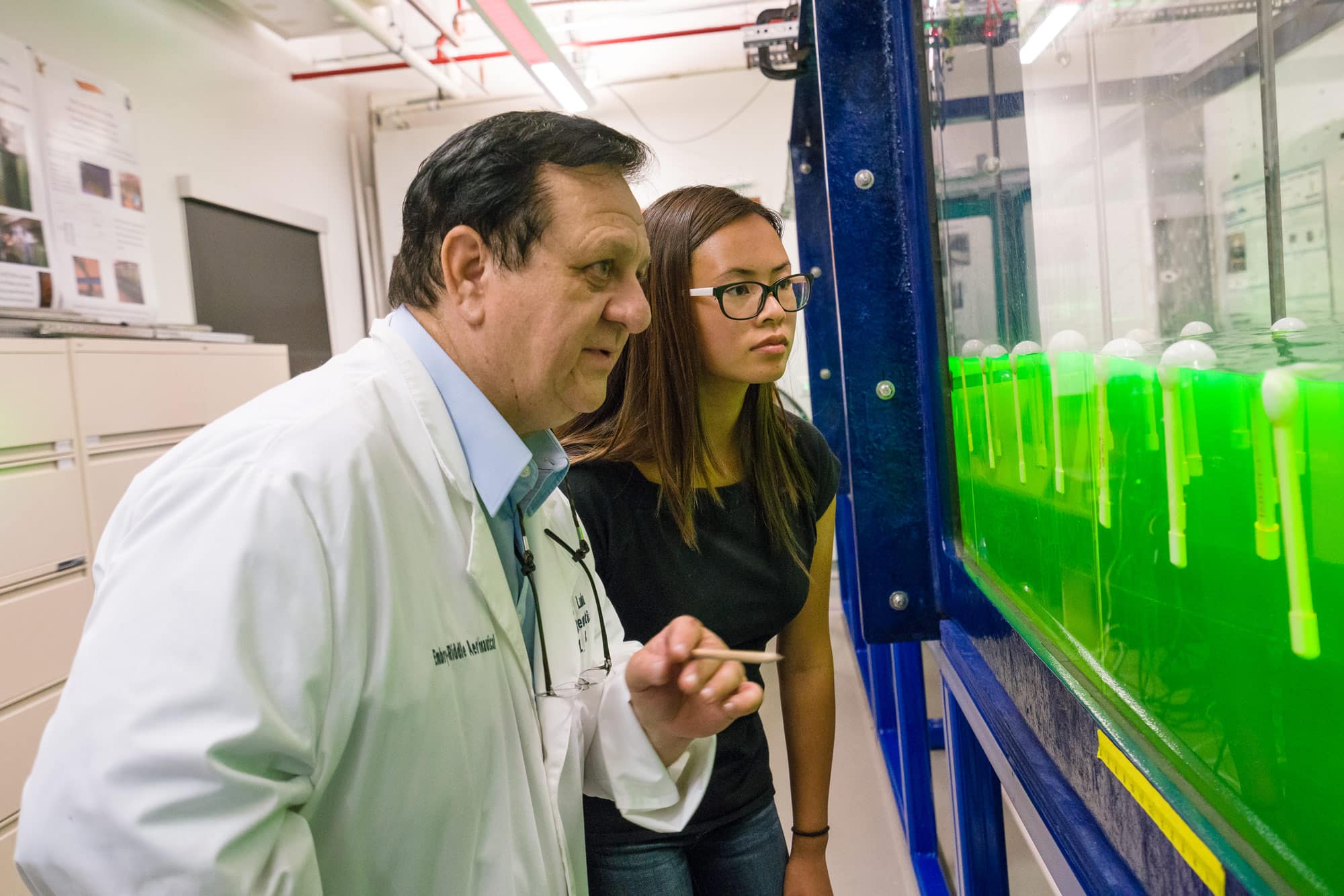 A professor and a student conduct research inside the Nonlinear Waves Lab