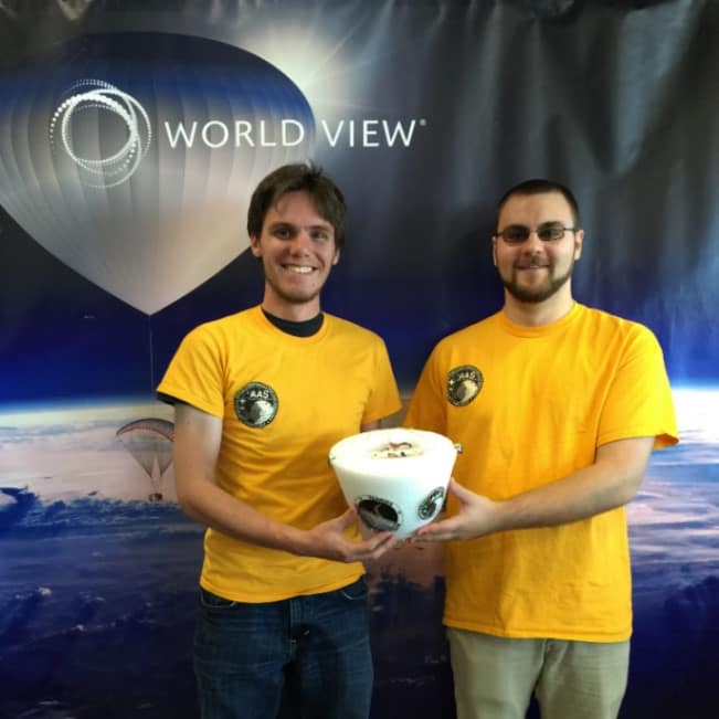 two students with a payload