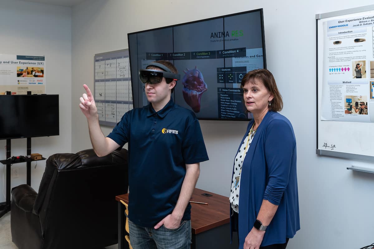 Ph.D. student William Shelstadt demonstrates a Microsoft HoloLens augmented reality headset using an application of a heart model and control gestures in the Human Factors User Experience Lab.