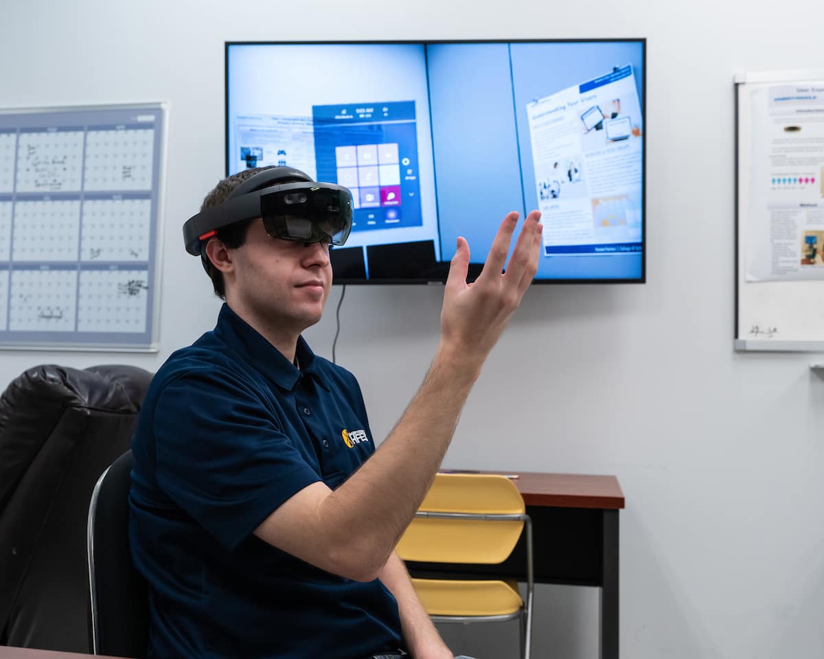 Ph.D. student William Shelstadt demonstrates a Microsoft HoloLens augmented reality headset using an application of a heart model and control gestures in the Human Factors User Experience Lab.