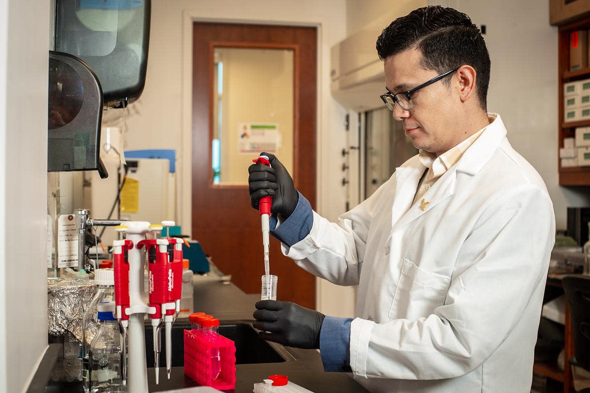Dr. Hugo Castillo conducting research on the effects of radiation on yeast samples from the International Space Station.