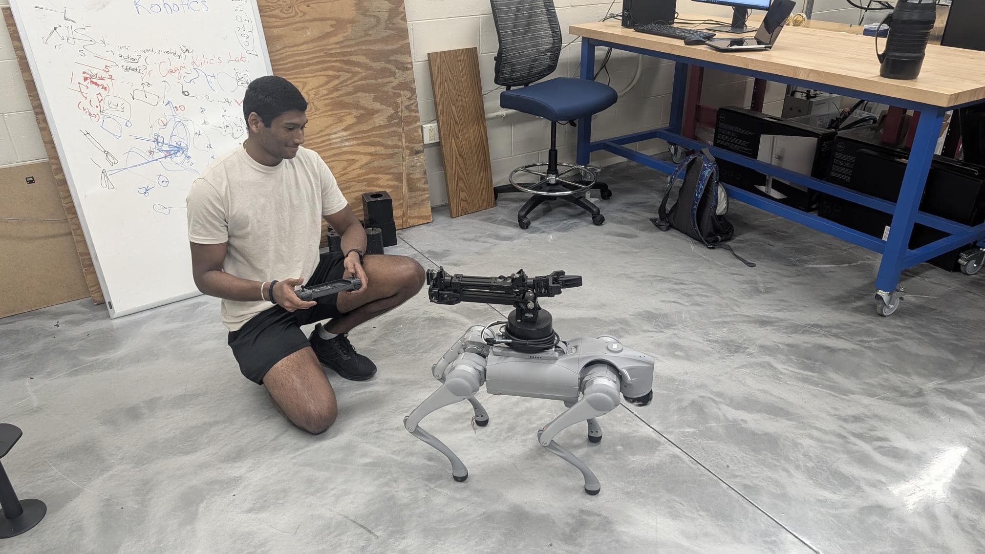 Student operating a robotic dog