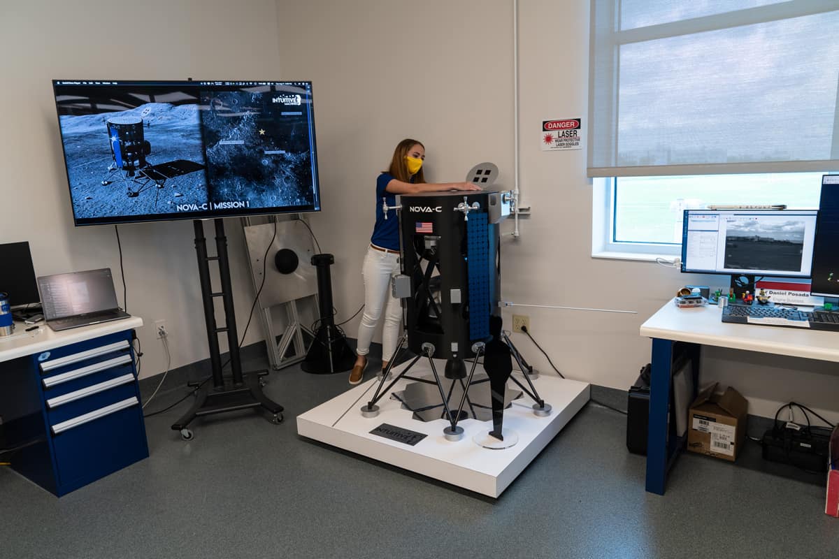 Taylor Yow, a bachelor of Science in Aerospace Engineering student, assembles an early version of a 1:3 scale model of the Nova-C Lunar Lander developed by Intuitive Machines.