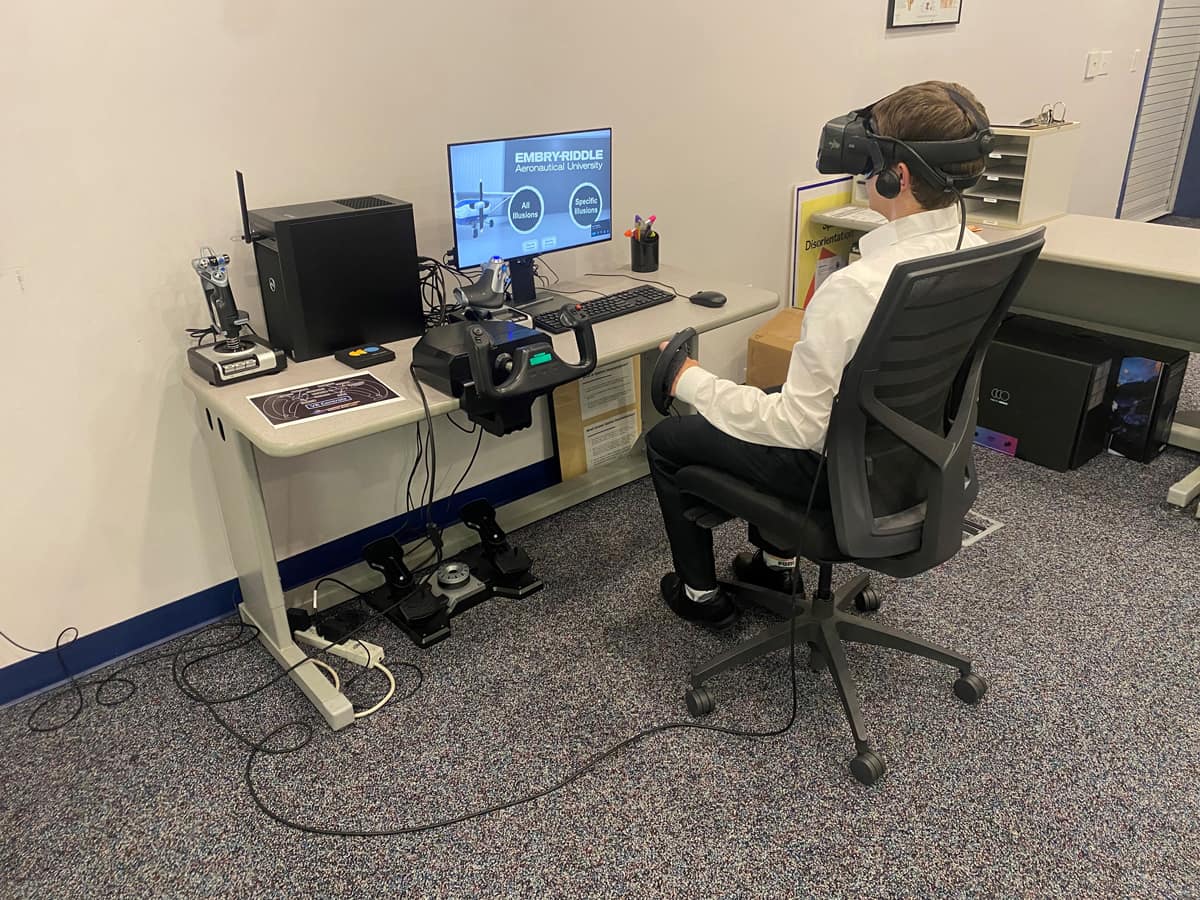 Student works with a simulator in the Spatial Disorientation Lab