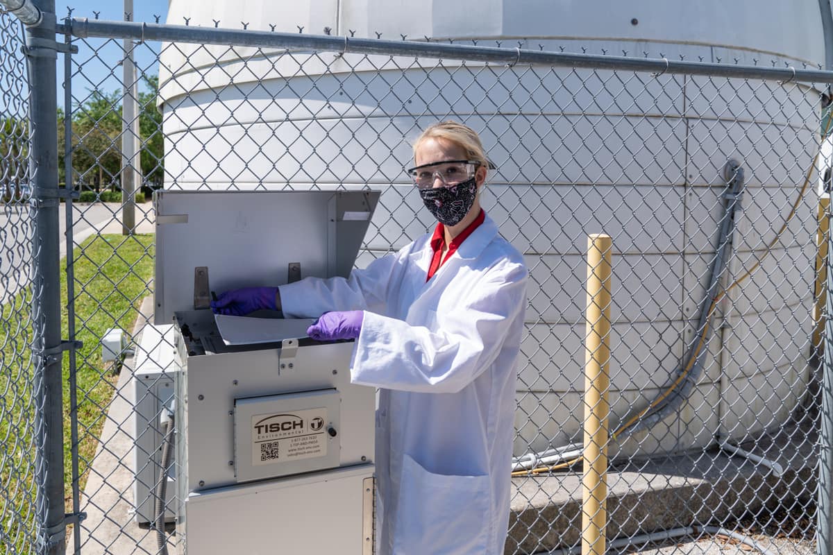 Civil Engineering undergraduate student Alexis Smith collects an ambient air sample to characterize microplastics in the atmosphere.