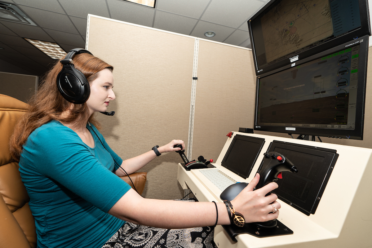Female student working on a UAS simulator.