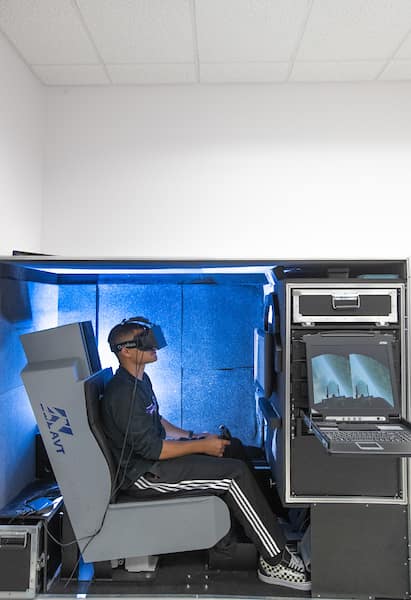 Sitting student uses virtual reality headset in the Virtual Reality Lab 