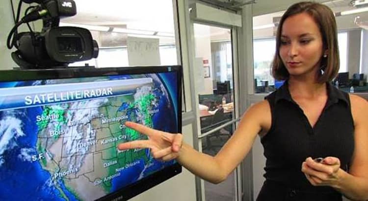 A student works in the weather broadcasting lab