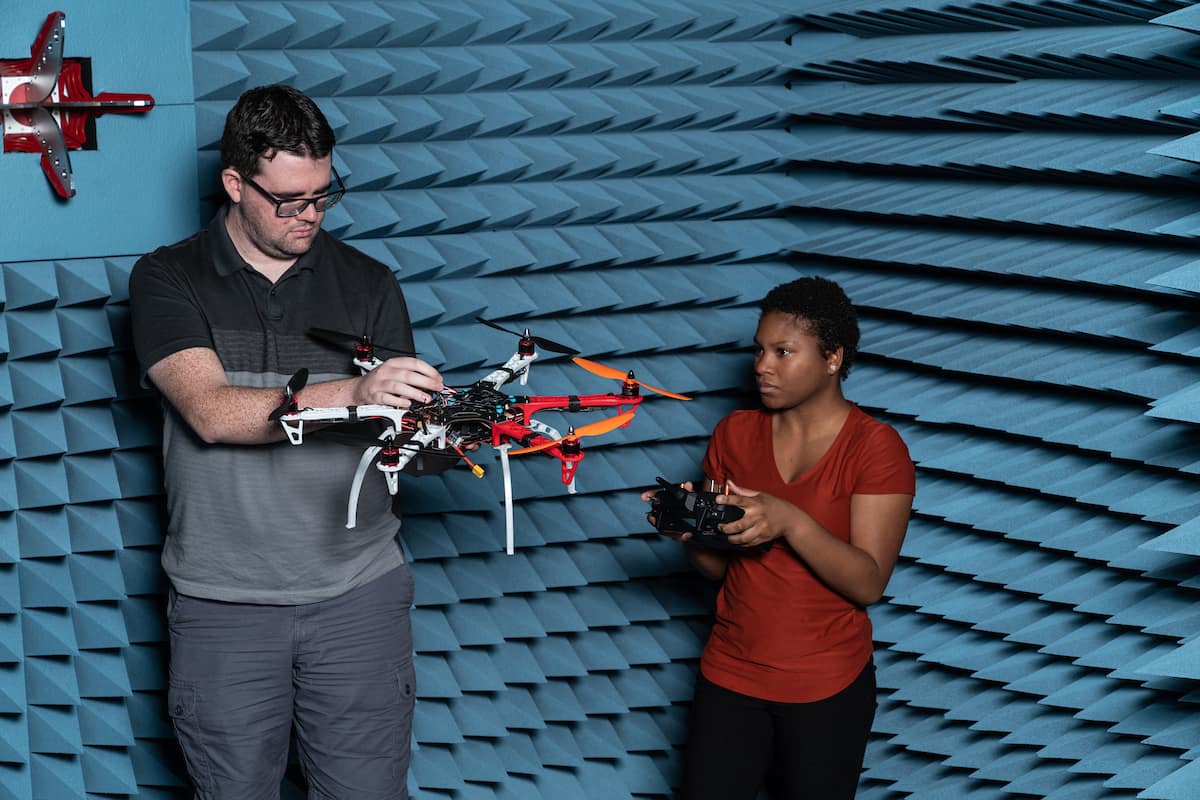Justin Parkhurst and Jodi Sanderson consider the noise potential of a UAV in the WiDE lab in the MicaPlex.