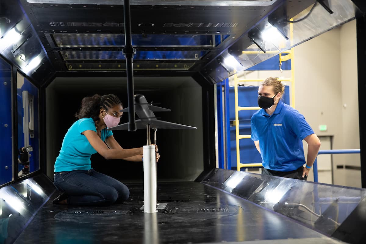 Students work in the wind tunnel
