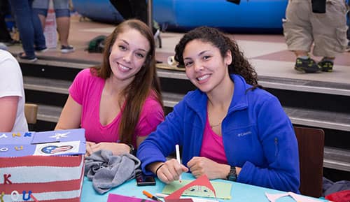 female students work at a desk