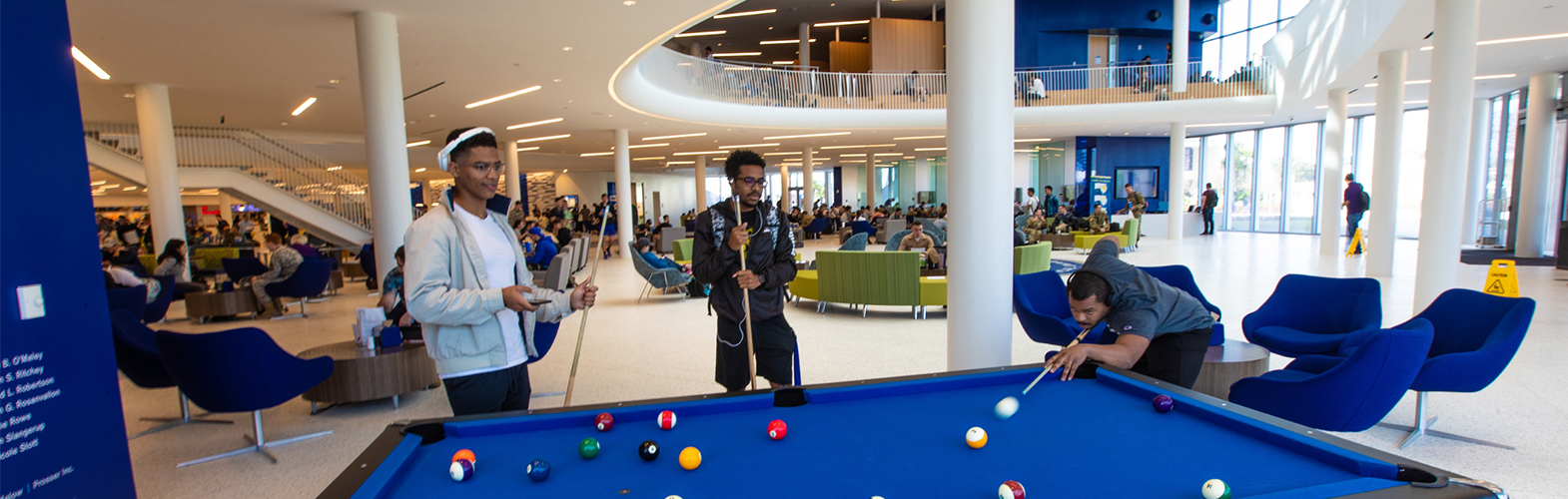 Students play pool in the Student Union