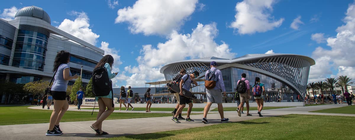 Students walk in front of the College of Arts and Science and the Student Union