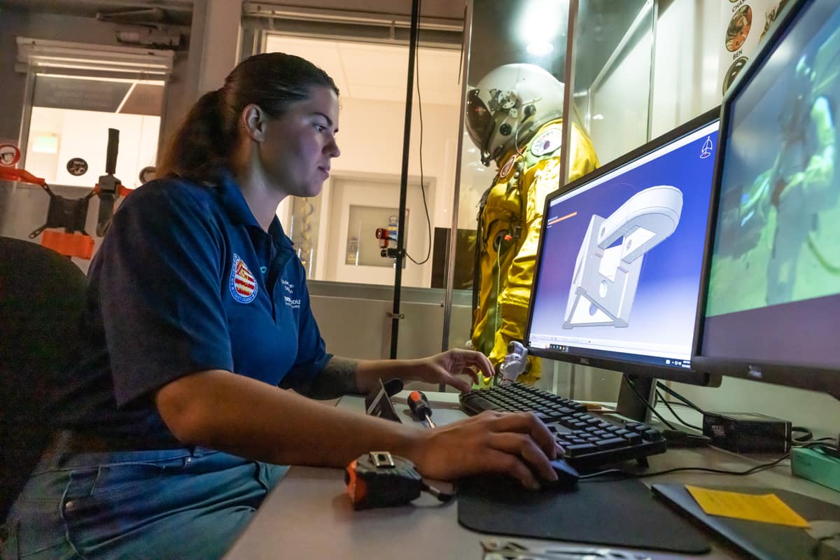Student working in suit lab.
