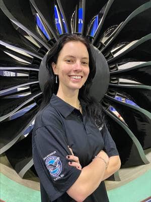 Woman in front of a jet engine